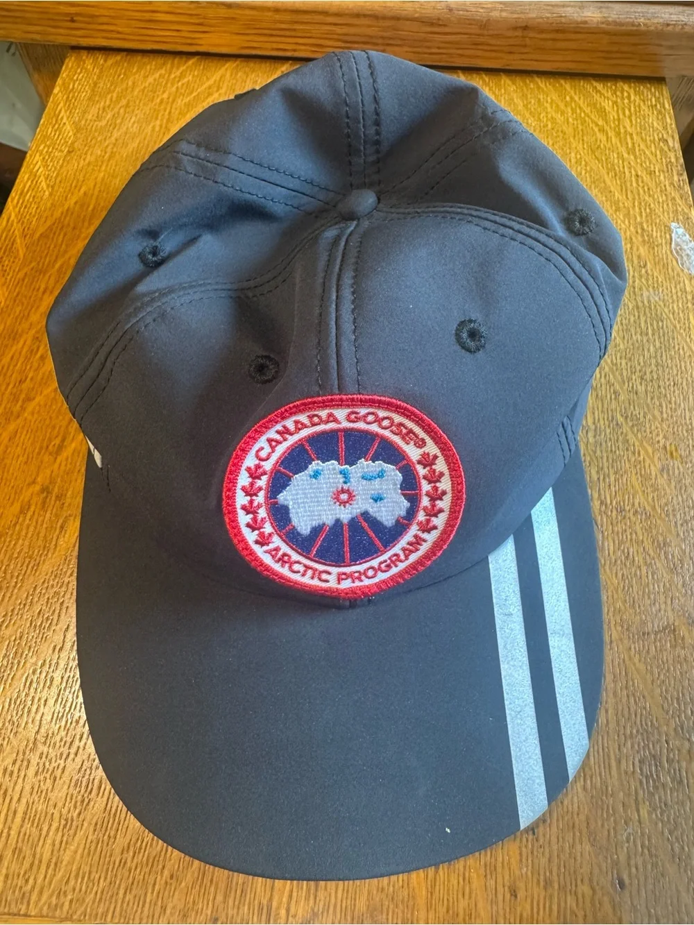 Canada Goose Black Hat with Red Arctic Patch and Silver Stripes
